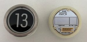 Кнопка приказа круглая, черная поверхность, белая надпись, "13" AVDBUT, KONE